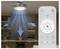 Ceiling fan with light illuminates a room, shown operating with remote control. Blue arrows indicate cool air flow from the fan.
