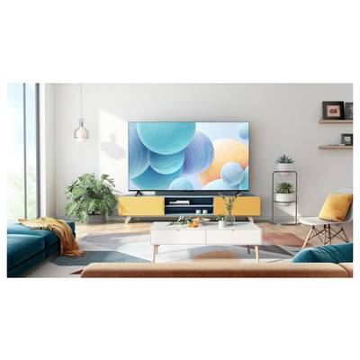 A modern living room with a large TV displaying abstract spheres on the wall. Stylish furniture includes a teal sofa and orange accents.