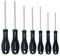 'Set of six green and black screwdrivers, varying in size, with rubber grips and chrome-vanadium tips, branded 'Facom'.'