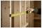 A person measures wooden beams with a yellow tape measure, aligning it between vertical supports, suggesting construction or carpentry work.