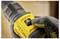 A gloved hand adjusts the torque setting on a yellow cordless drill, showing the number '2'.
