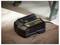 'A black Stanley FatMax battery charger resting on a wooden surface.'