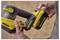 A person holding a yellow power tool with 'Stanley FatMax V20' branding, focusing on the battery attachment area.