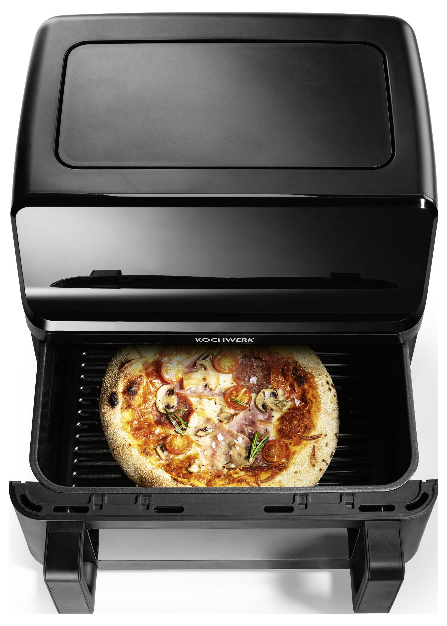 A pizza with toppings like mushrooms and peppers is baking in a black, open pizza oven.