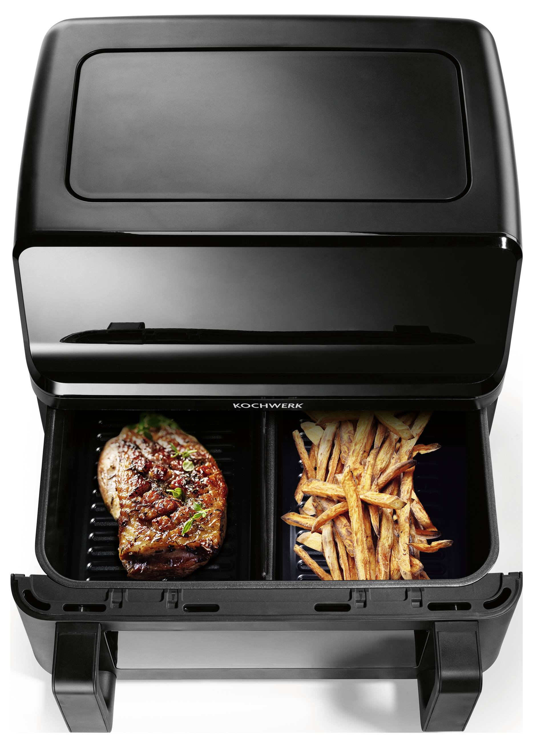 A black dual-compartment air fryer cooking a seasoned steak on the left and golden-brown French fries on the right.