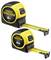 Two Stanley Fatmax tape measures, one 8m and one 5m, with black and yellow casings and extended yellow measuring tapes.