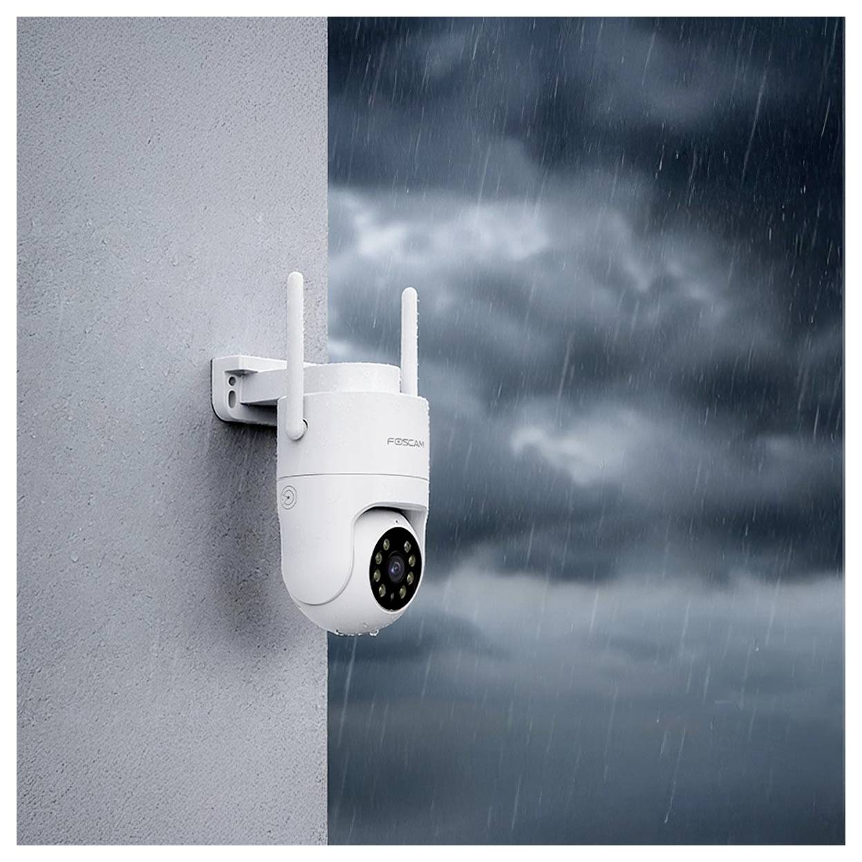 A white security camera mounted on a wall, angled towards a stormy, rainy scene, indicating weather resistance and outdoor surveillance.