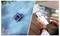 On the left, a robotic pool cleaner operates in a blue-tiled pool. On the right, a person adjusts pool settings on a smartphone app next to a cup of coffee.