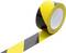 Roll of black-and-yellow hazard warning tape with a strip unspooled on a white background.<br>