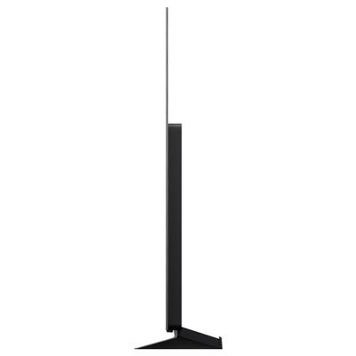 Minimalist black floor lamp with a tall thin stem and narrow rectangular light head on a triangular base.