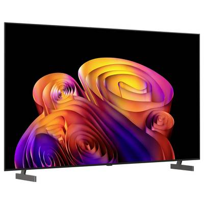 A flat-screen TV displaying a colorful abstract swirl wallpaper on a black background, with the TV stand visible.<br>
