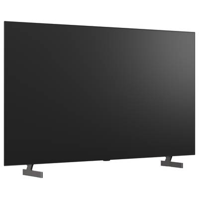 A large flat-screen TV with a blank black screen on stand legs against a white background.