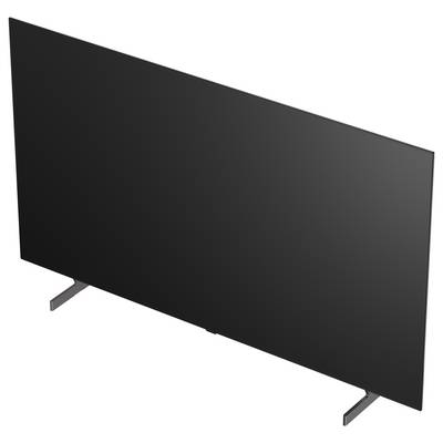Black flat-screen TV or monitor on two stand legs, shown at an angle against a white background.