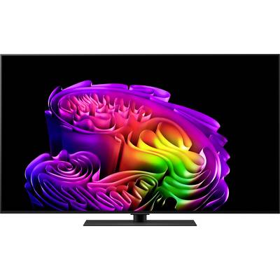 Abstract colorful flower-like swirl pattern on a TV screen, with bright rainbow gradients against a black background.