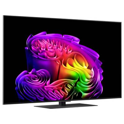 A flat-screen TV displaying a colorful abstract swirling rainbow design on a black background.