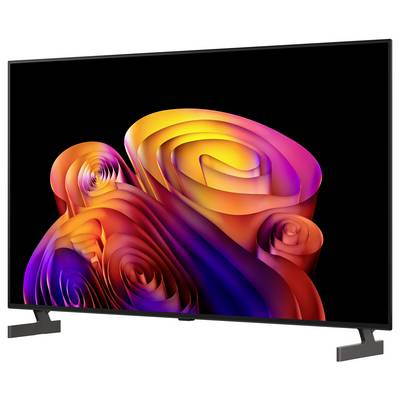 A flat-screen TV displays a colorful abstract swirl wallpaper on a black background, shown on a stand.