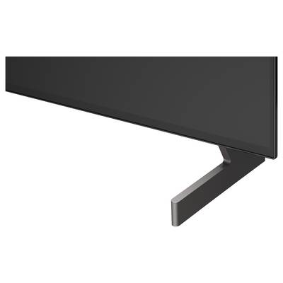 Close-up of a flat-screen TV or monitor with a black bezel and angled stand on a white background.