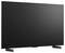 Front view of a large flat-screen TV with a blank dark display and two angled stand feet.