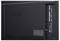 Back of an LG OLED TV showing the rear input panel with ports and mounting holes.<br>