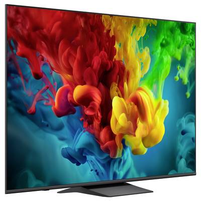 A flat-screen TV displaying a vivid abstract swirl of red, yellow, green, and blue paint-like colors.