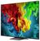 Flat-screen TV displaying a vivid abstract image of colorful paint clouds in red, yellow, green, and blue on a dark background.