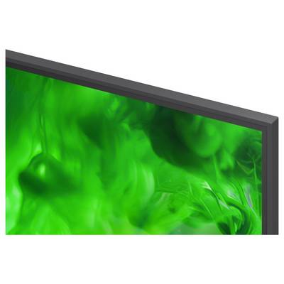Abstract green fluid or smoke-like pattern on a framed display, suggesting a vivid digital artwork or screensaver.