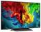 Flat-screen TV displaying colorful swirling ink or paint in red, yellow, green, and blue on a dark background.