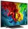 Flat-screen TV displaying a bright abstract splash of red, yellow, green, and blue paint on a dark background.