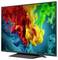 Flat-screen TV displaying a vivid abstract splash of red, yellow, green, and blue color clouds on a dark background.