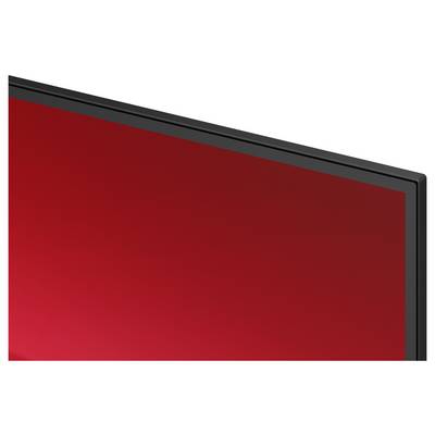 Close-up of a flat-screen display with a blank red screen and black bezel, shown at an angle.