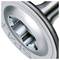 Close-up of a metallic valve or impeller-like industrial part with a central opening and embossed lettering on the rim.<br>