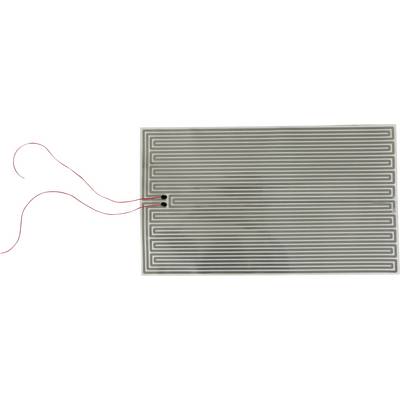 Rectangular heating mat with a serpentine conductive track; two red leads connect at the left edge.