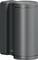 A cylindrical metal wall-mounted device or sensor with a dark side bracket, shown in close-up on a plain background.