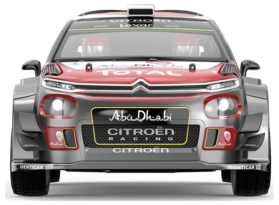 Front view of a Citroën rally car with Abu Dhabi and Total branding, headlights on, centered on a white background.