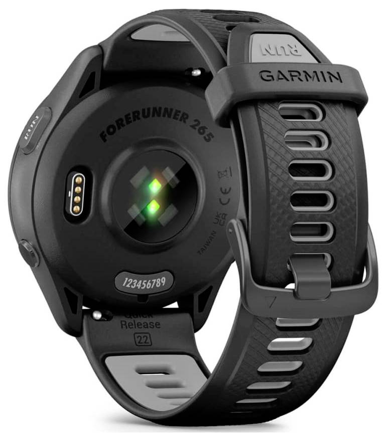 Back view of a Garmin Forerunner 265 smartwatch with black sport band, showing heart rate sensor and charging contacts.
