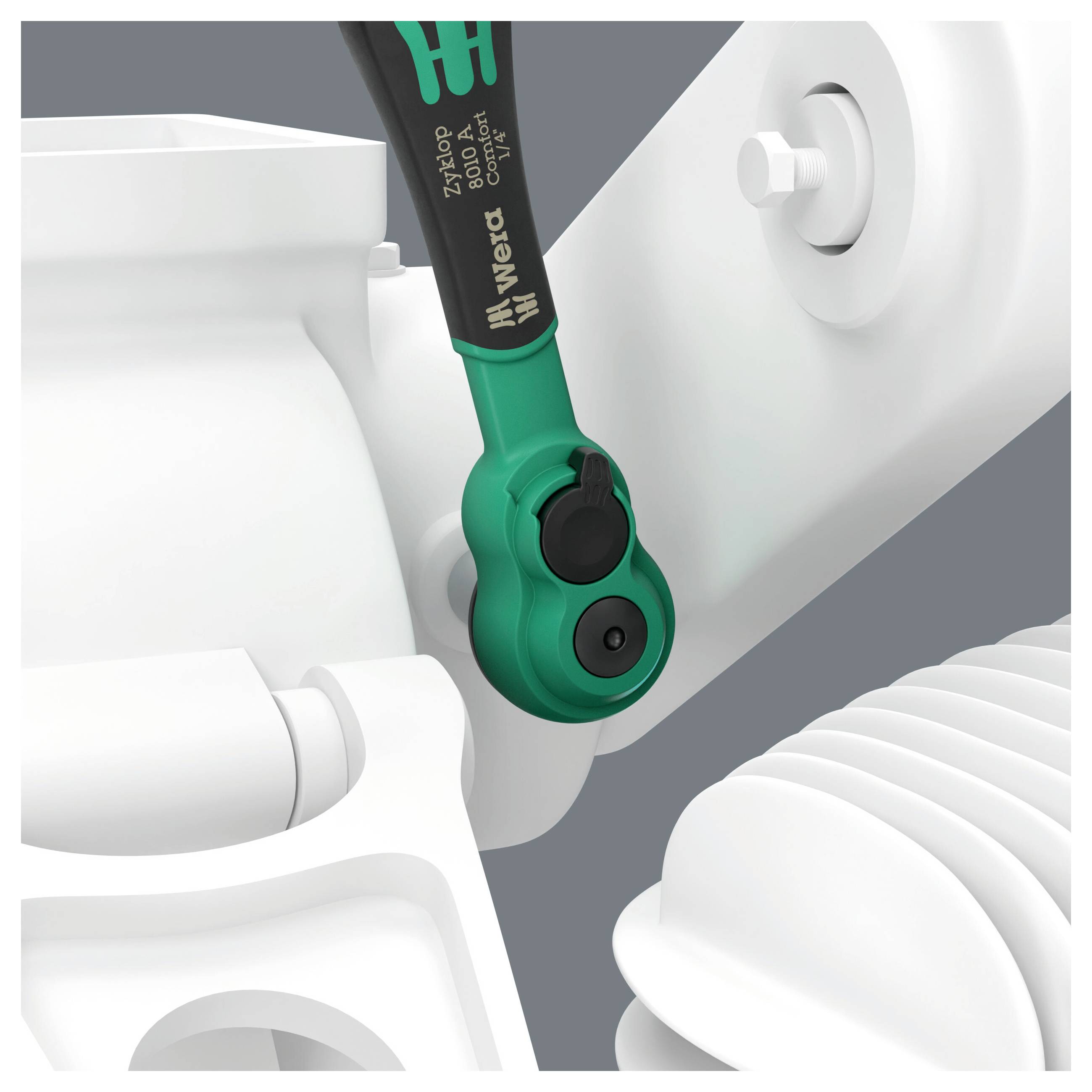 Close-up of a green-and-black Wera screwdriver bit engaged in a white mechanical assembly or device housing.