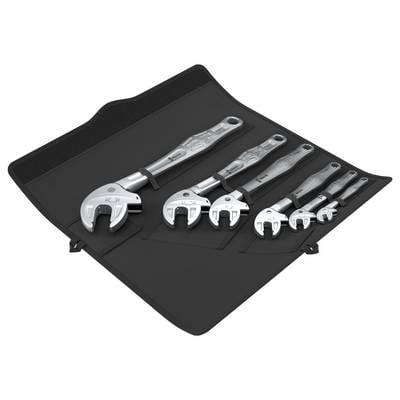 Set of five adjustable wrenches arranged on a black roll-up tool pouch.