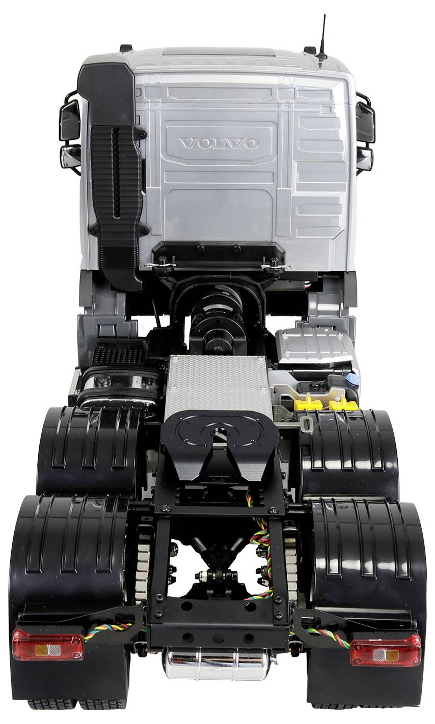 Rear view of a Volvo truck chassis cab with twin rear axles, exposed frame and mechanical components, photographed on a white background.