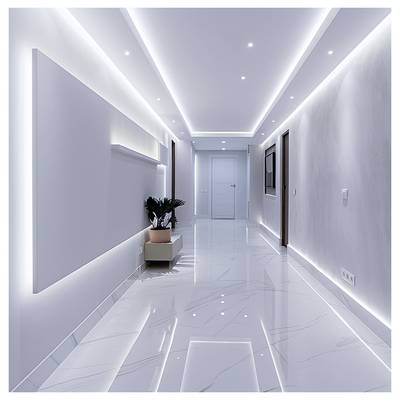 Modern minimalist hallway with glossy white marble floor, recessed ceiling lights, wall-mounted TV, and a small plant by a side cabinet leading to a closed door.