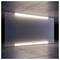 Translucent glass panel lit by bright horizontal light strips at the top and bottom, set in a dark modern interior.