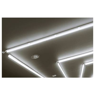 Ceiling with bright linear LED light fixtures arranged in angular patterns, with recessed circular lights on a dark surface.