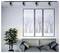Modern living room with gray sofa and pillows, potted plant, and three framed winter tree prints under track lighting.