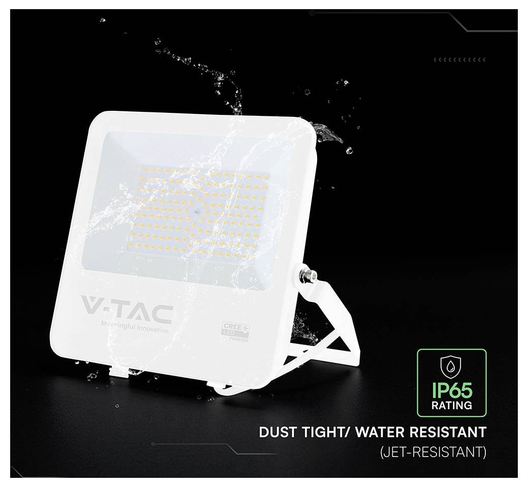 White V-TAC LED floodlight on stand, shown with water splashing to emphasize IP65 dust-tight, jet-resistant waterproof rating.