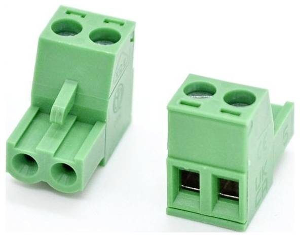 Two green two-pin electrical terminal block connectors shown on a white background, one angled with side entry and one front-facing.
