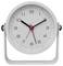 Round analog clock showing about 10:10, with a red second hand and a silver stand.<br>