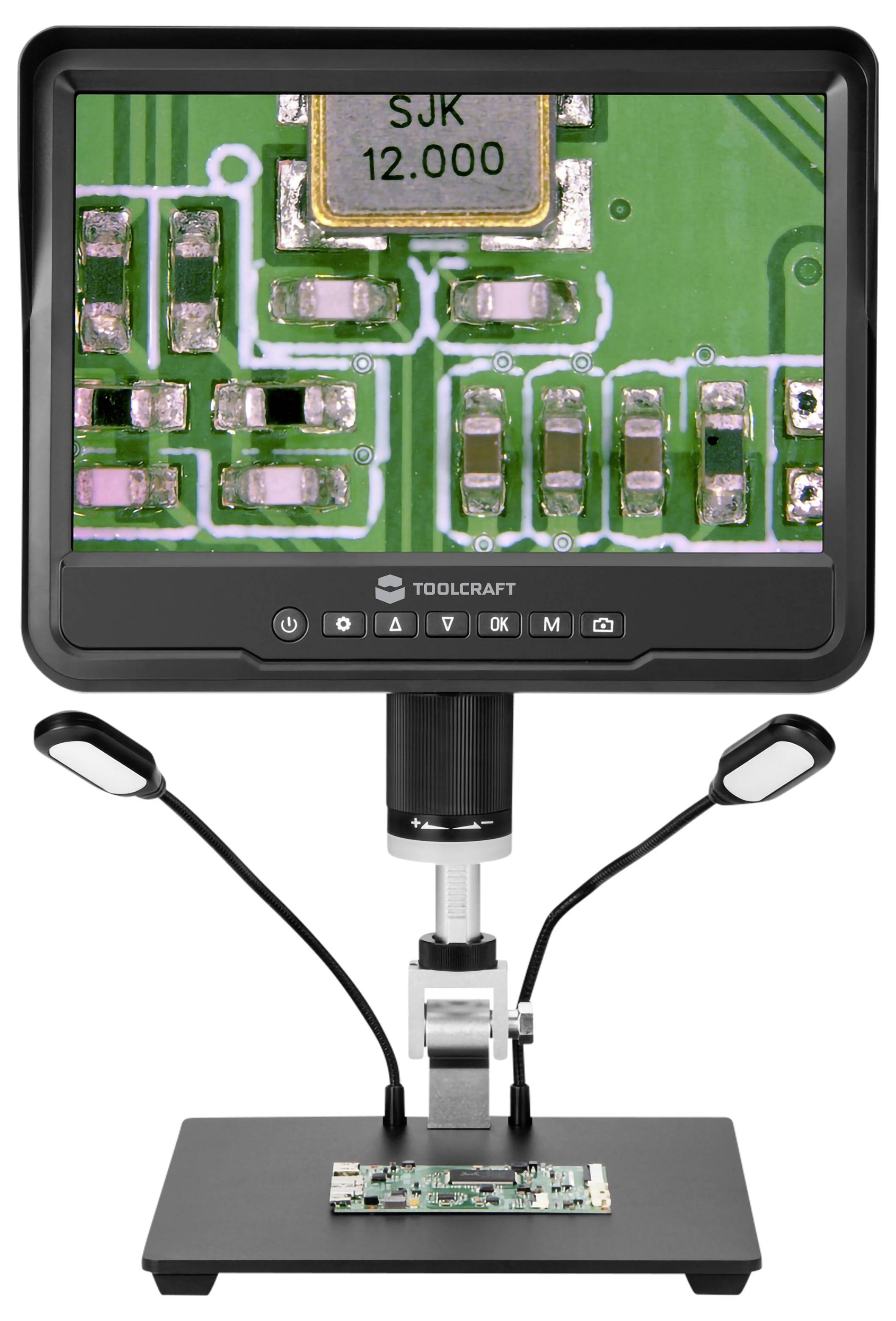 Digital microscope showing a close-up of a circuit board on the screen, with the board mounted on the stand below for inspection.