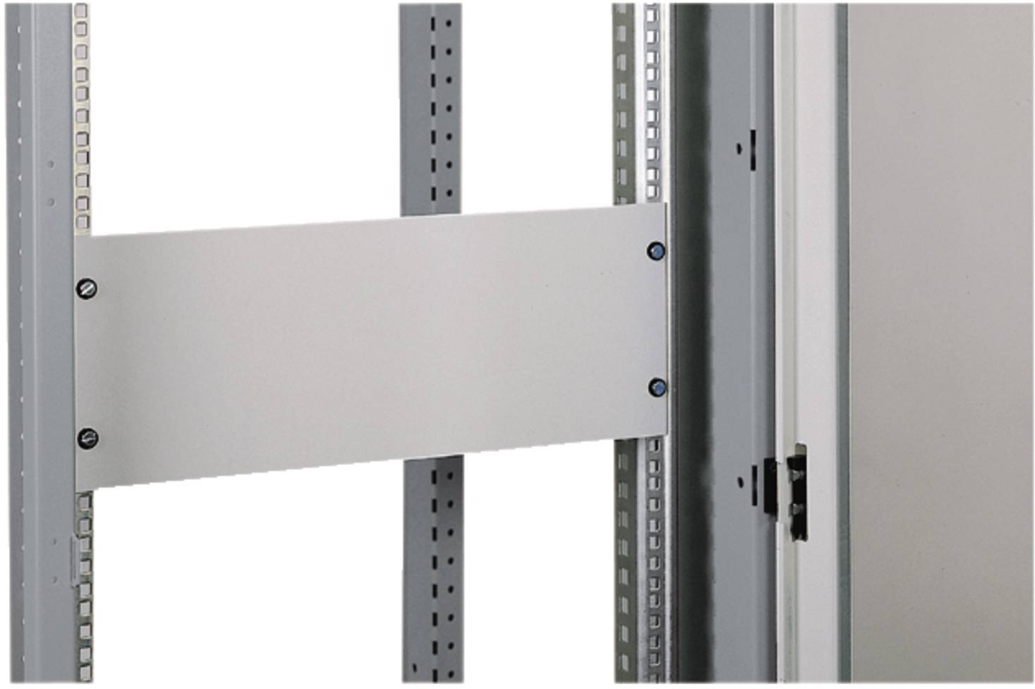 Metal server rack cable management panel mounted between vertical rails inside an equipment cabinet, with adjacent door hinge visible.