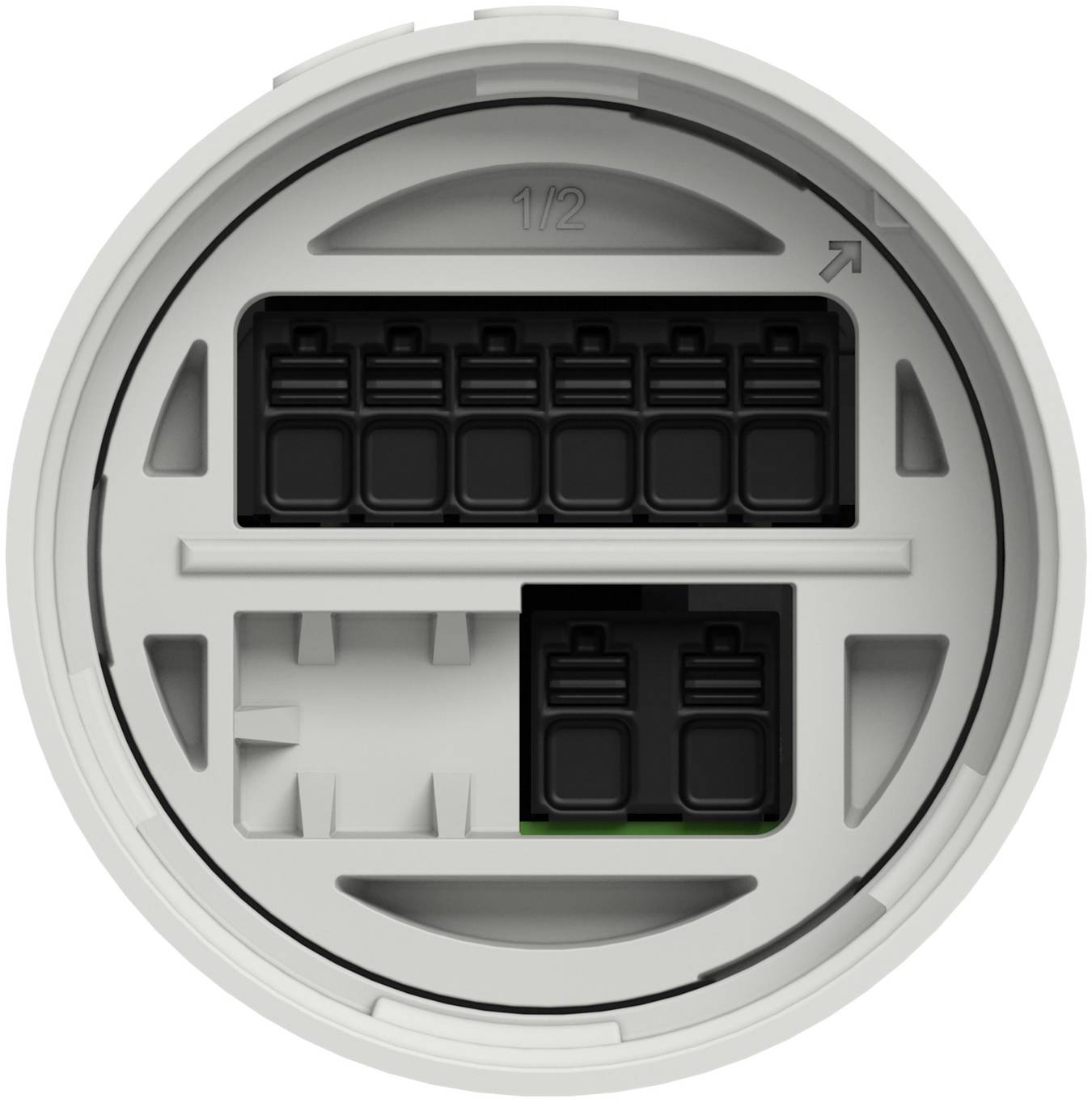 Close-up of a circular electrical connector socket with multiple black terminal slots and a '1/2' marking, likely a wiring interface.<br>
