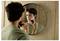 Man shaving in a bathroom mirror with an electric trimmer, looking at his reflection.