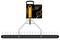 Fiskars OneClick aerator rake shown in packaging, with a black rake head and orange handle attachment on a white background.